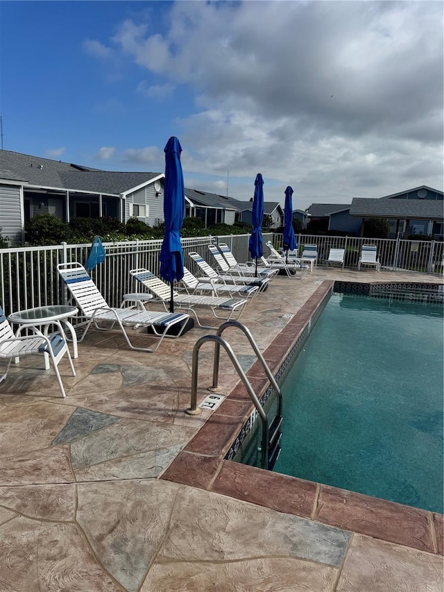 view of swimming pool with a patio