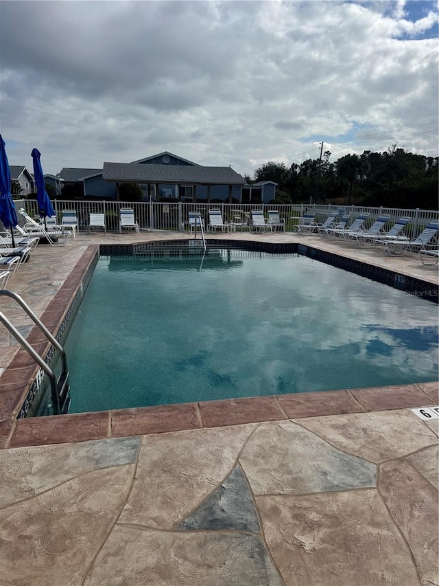 view of pool featuring a patio