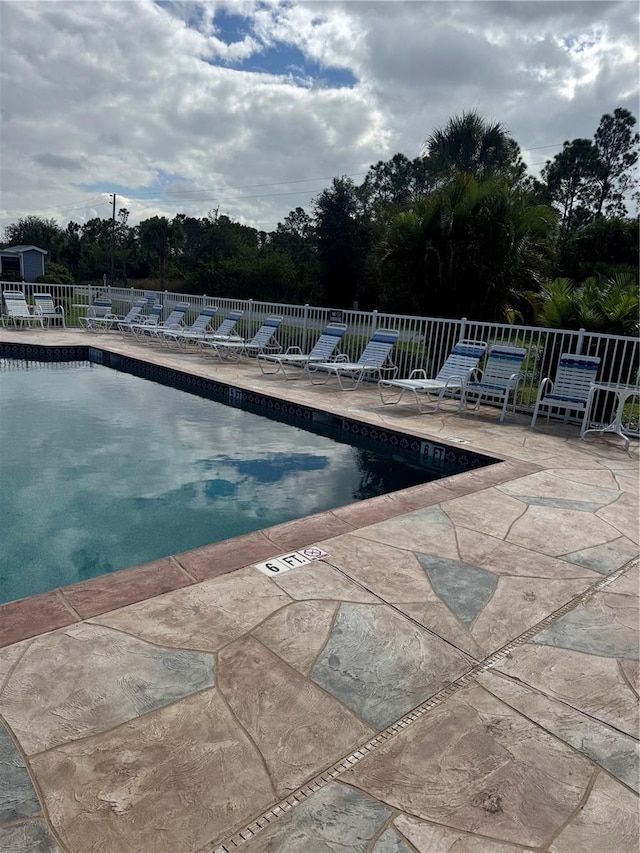 view of swimming pool with a patio