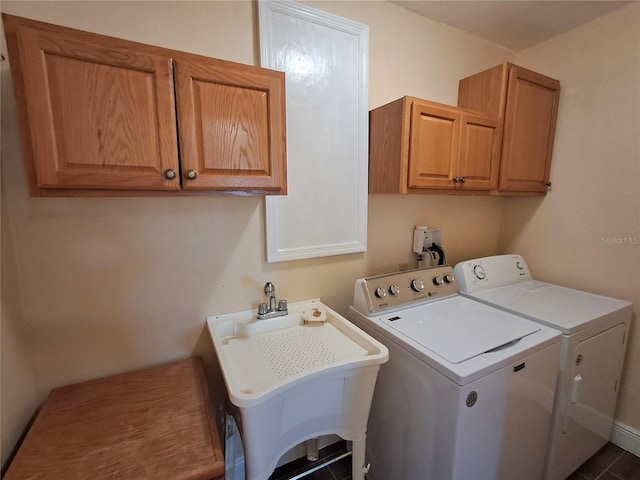 laundry area with cabinets, sink, and washer and dryer