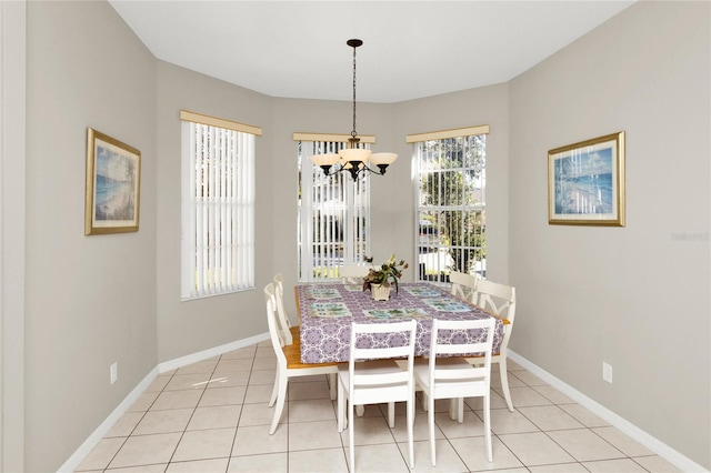 tiled dining space with a notable chandelier