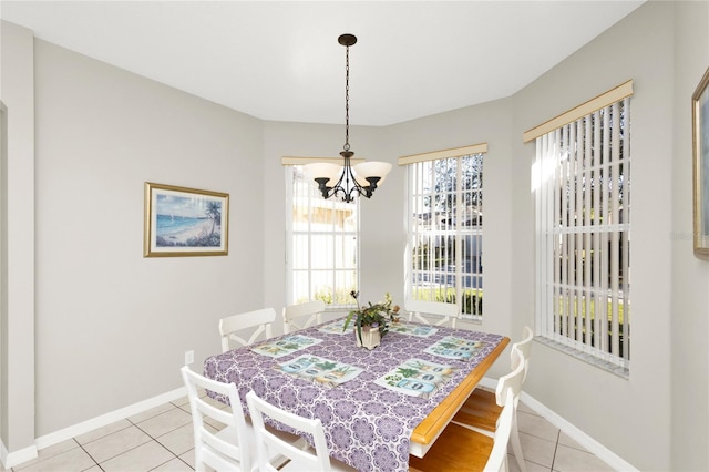 tiled dining area with a notable chandelier