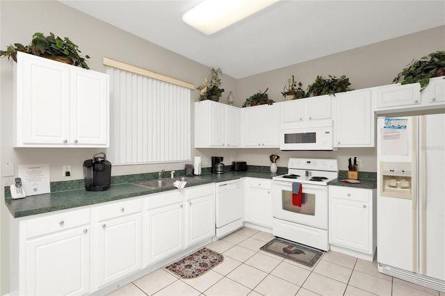 kitchen featuring white cabinets, white appliances, sink, and light tile patterned floors