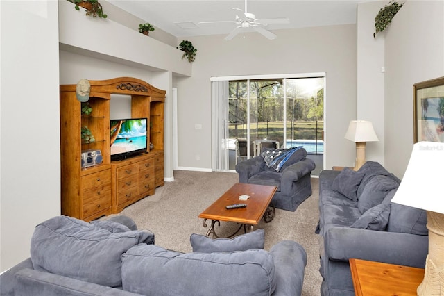 living room with ceiling fan and carpet floors