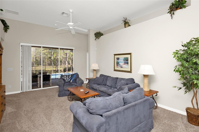 carpeted living room featuring ceiling fan