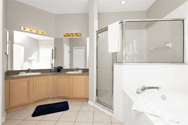 bathroom featuring tile patterned flooring, vanity, and an enclosed shower