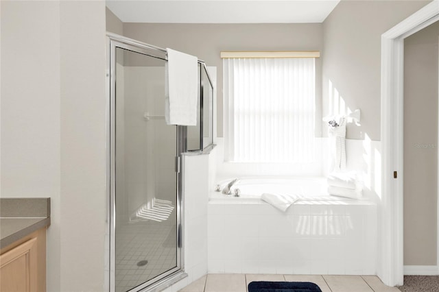 bathroom featuring vanity, tile patterned floors, and independent shower and bath