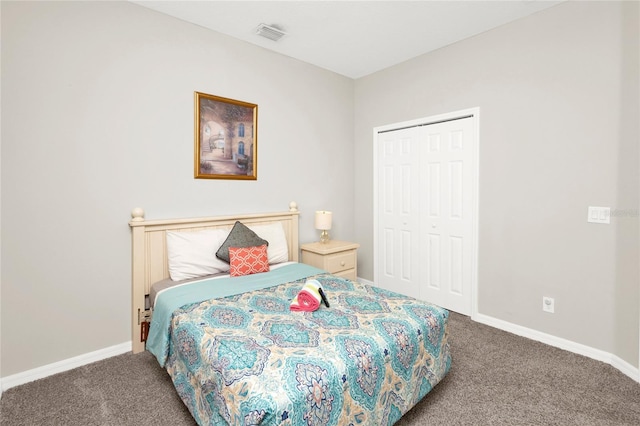 bedroom with carpet and a closet