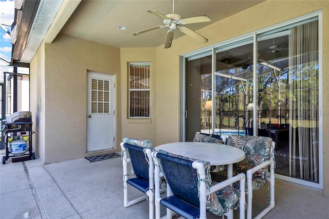 view of patio / terrace featuring ceiling fan