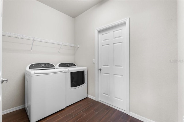 clothes washing area with washer and clothes dryer