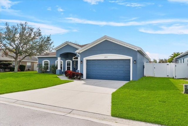 view of front facade featuring a garage and a front lawn