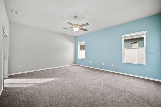 carpeted empty room with ceiling fan