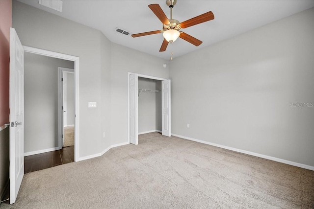 unfurnished bedroom featuring ceiling fan, carpet flooring, and a closet