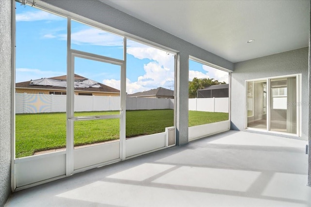 unfurnished sunroom featuring plenty of natural light