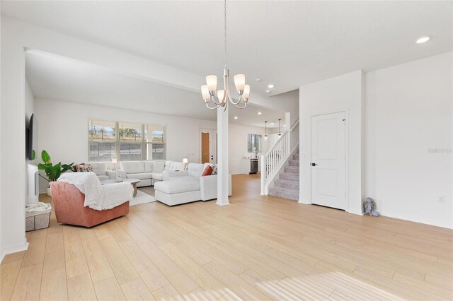 9660 Westside Hills Dr, Davenport, FL 33896 - living room featuring light wood-style floors, a chandelier, recessed lighting, and stairway