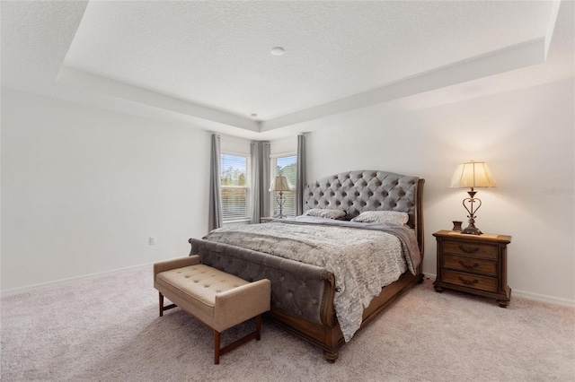 9660 Westside Hills Dr, Davenport, FL 33896 - bedroom with a raised ceiling, light carpet, baseboards, and a textured ceiling
