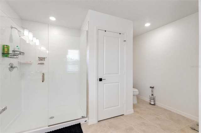 bathroom with tile patterned flooring, an enclosed shower, and toilet