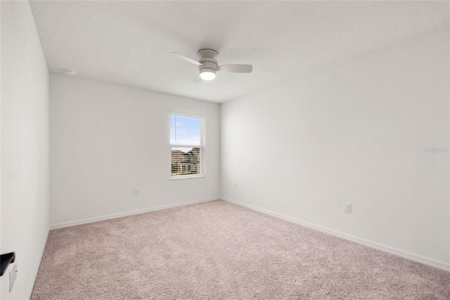 9660 Westside Hills Dr, Davenport, FL 33896 - carpeted empty room with a ceiling fan, baseboards, and a textured ceiling