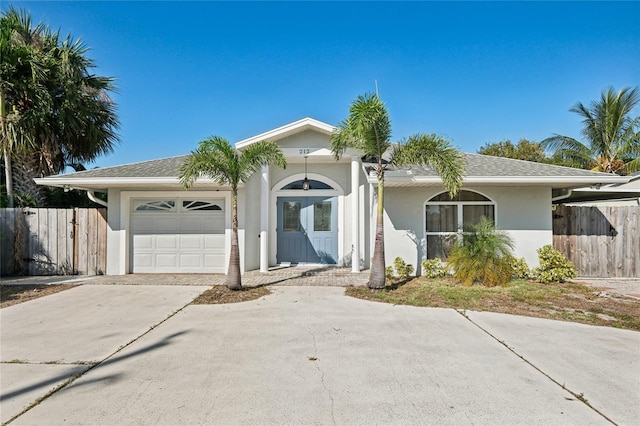 single story home featuring a garage