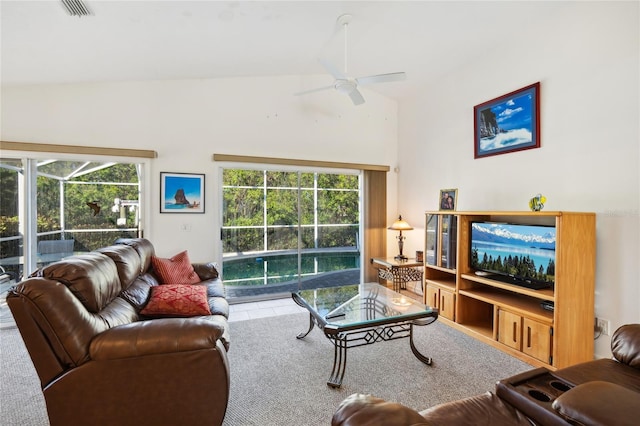 living room featuring ceiling fan, high vaulted ceiling, and a healthy amount of sunlight