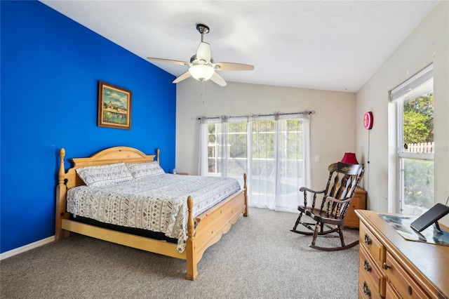 bedroom with ceiling fan, light carpet, and vaulted ceiling