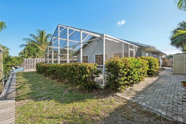 view of home's exterior with a lanai