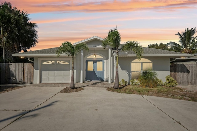 ranch-style house featuring a garage