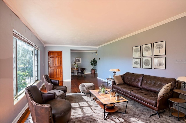 living room with dark hardwood / wood-style floors, plenty of natural light, crown molding, and ceiling fan