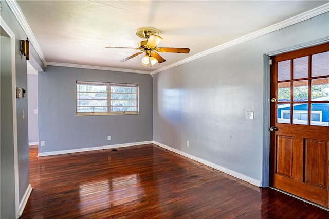 foyer with ceiling fan, dark hardwood / wood-style flooring, and ornamental molding