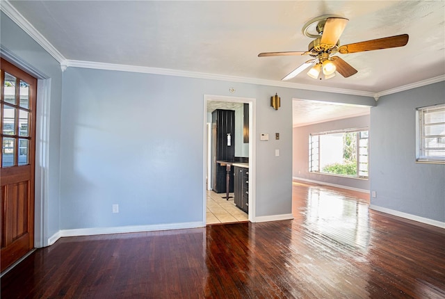 interior space with light hardwood / wood-style floors, ceiling fan, and ornamental molding