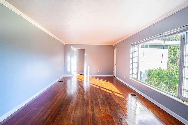 unfurnished room with crown molding and wood-type flooring