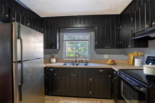 kitchen featuring stainless steel fridge, black / electric stove, ornamental molding, and sink