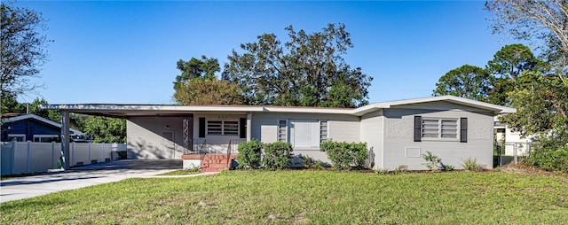 ranch-style house with a front yard and a carport