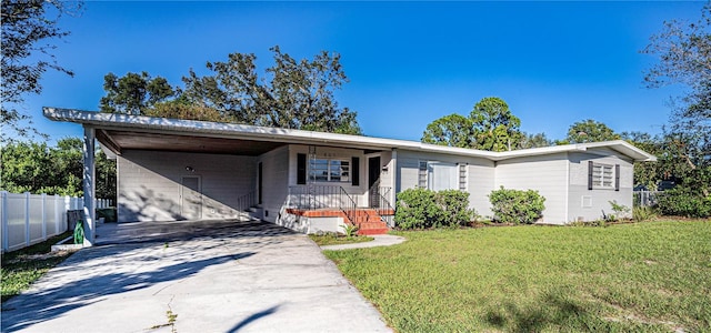 single story home featuring a front yard and a carport