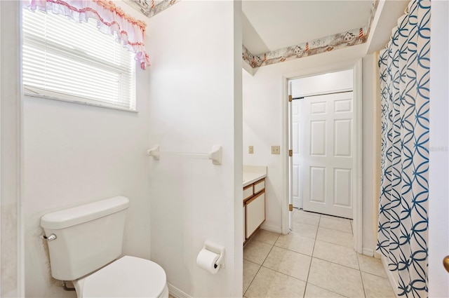 bathroom with tile patterned floors, vanity, and toilet