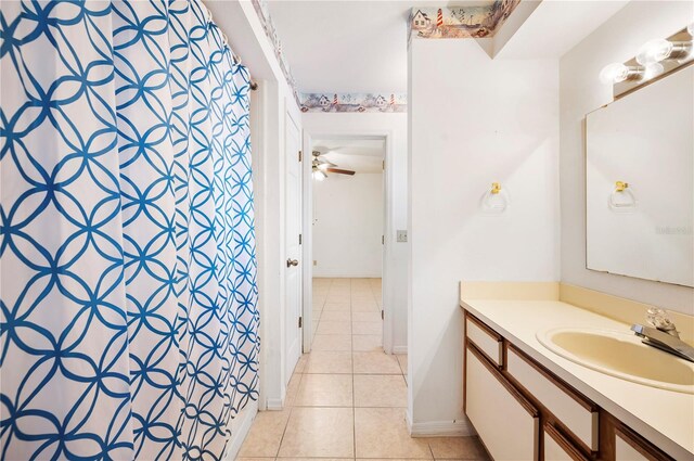 bathroom featuring tile patterned flooring and vanity