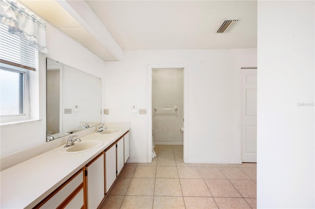 bathroom with tile patterned floors and vanity