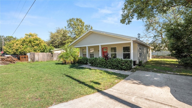 bungalow-style house featuring a front yard and covered porch