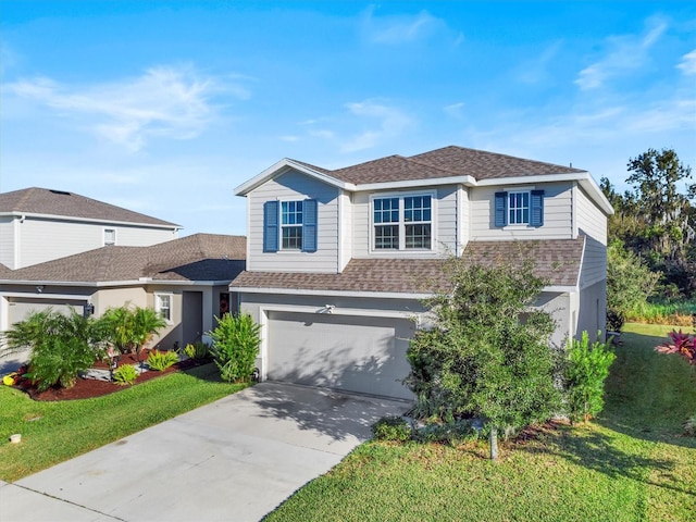 view of front of home featuring a garage and a front yard