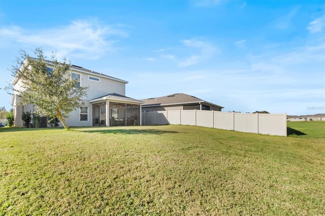 view of yard featuring a sunroom