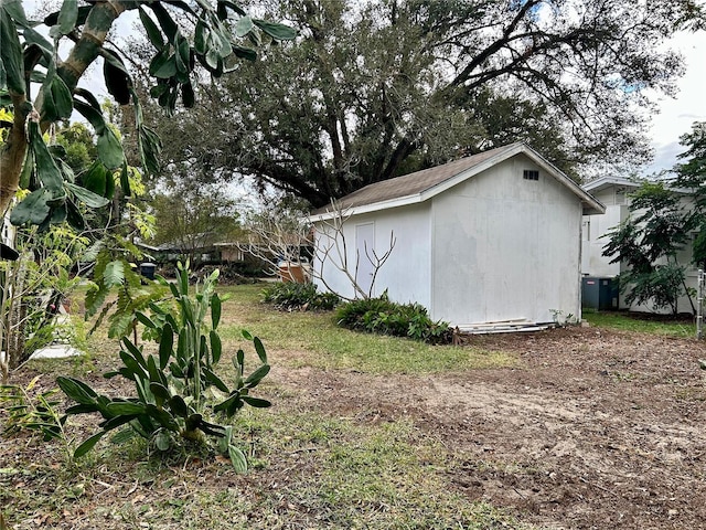 view of side of property featuring an outbuilding