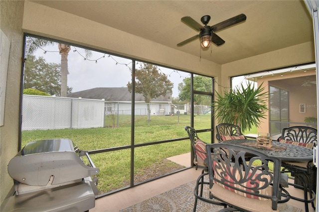 sunroom / solarium with ceiling fan