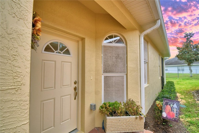 1644 Linz Ct, Winter Haven, FL 33884 - view of exterior entry featuring stucco siding