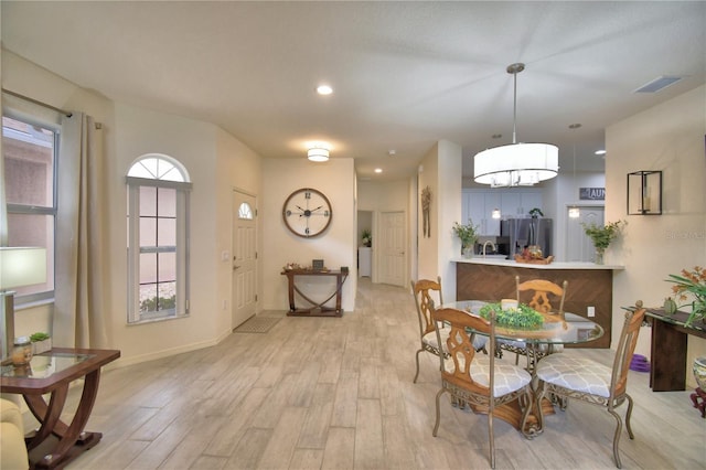 dining room with light hardwood / wood-style floors