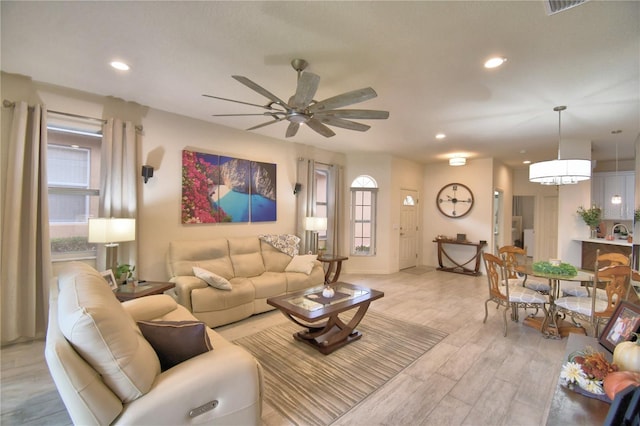 1644 Linz Ct, Winter Haven, FL 33884 - living area with a ceiling fan, recessed lighting, light wood-style flooring, and baseboards