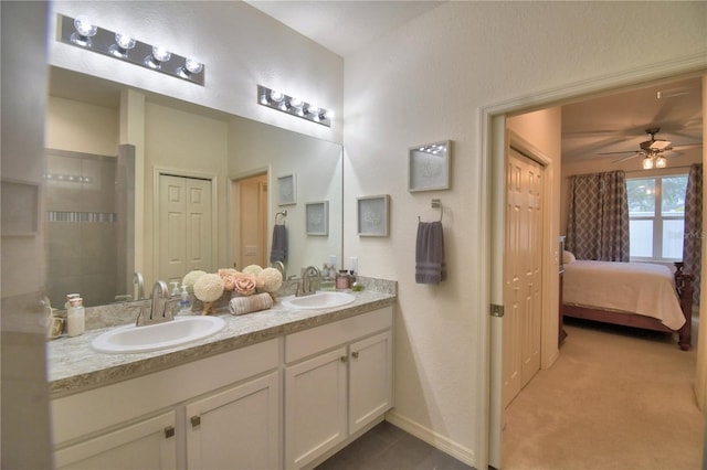 1644 Linz Ct, Winter Haven, FL 33884 - ensuite bathroom with double vanity, a ceiling fan, and baseboards