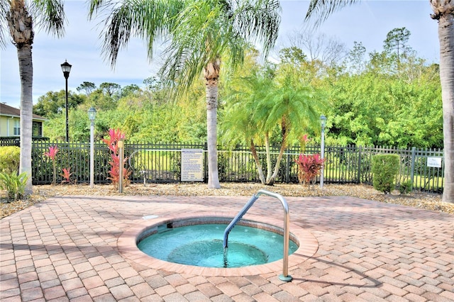 view of pool featuring a hot tub