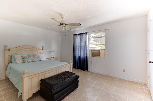 tiled bedroom with ceiling fan and a textured ceiling