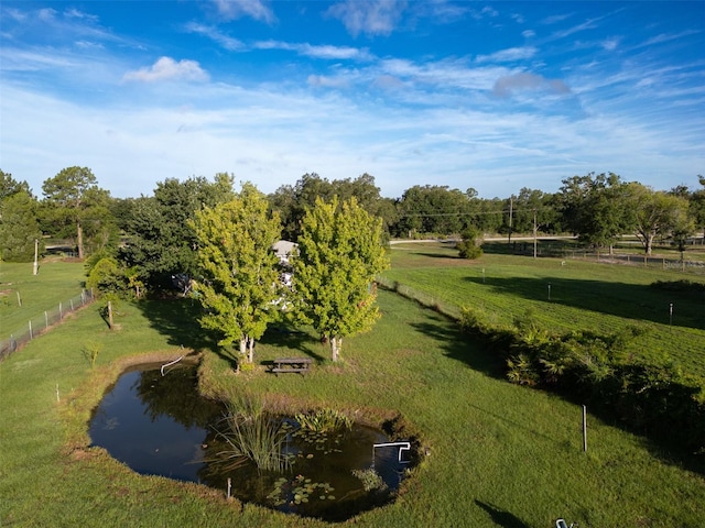 surrounding community featuring a rural view and a water view