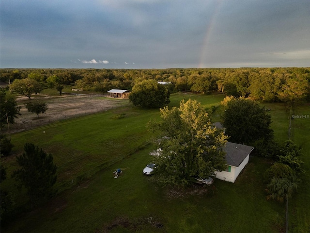 birds eye view of property with a rural view